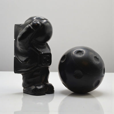 Astronaut with marble moon