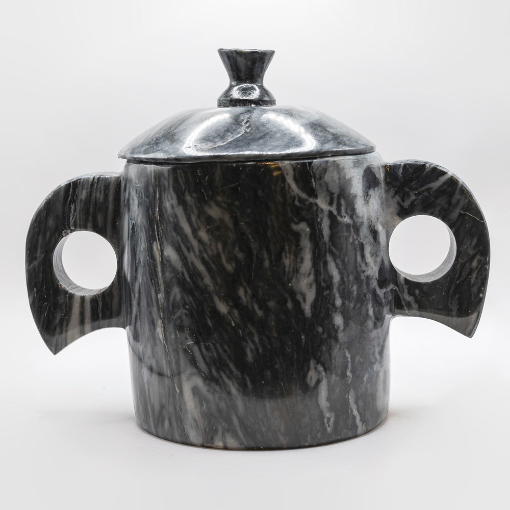 Sugar bowl with black marble ears.