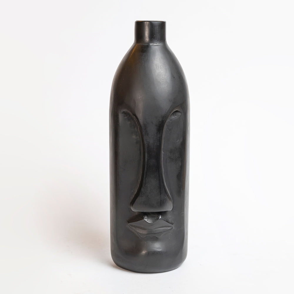 Large bottle with marble face.