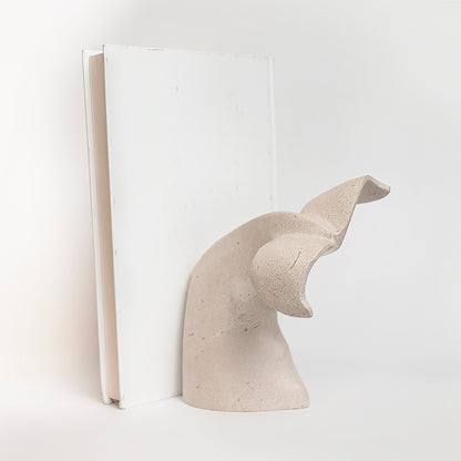 Marble whale bookholder.