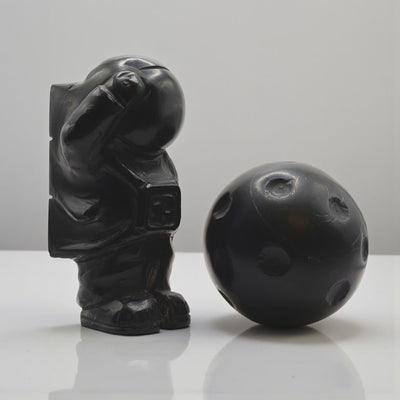 Astronaut with marble moon